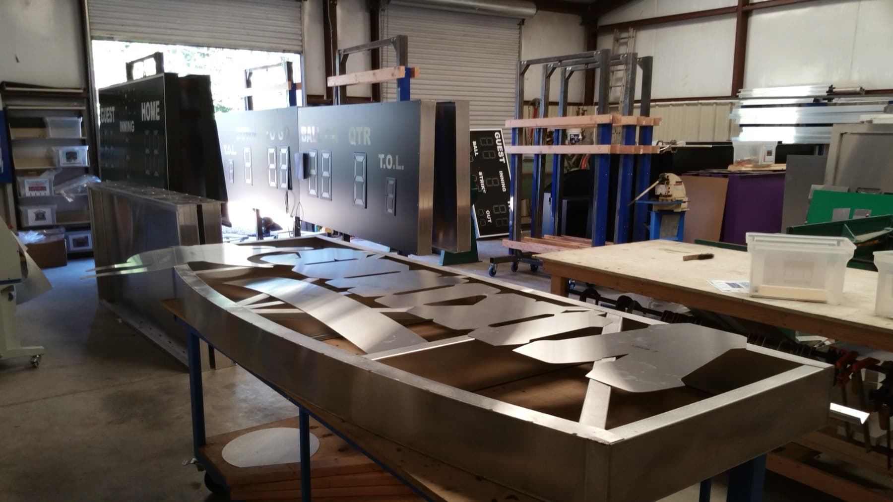 Aluminum scoreboard cabinet frames on the bench during fabrication